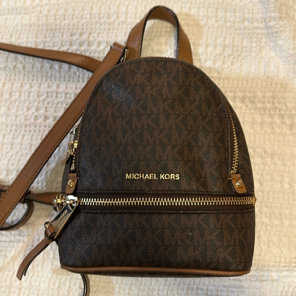 Brown and tan mini backpack. Used